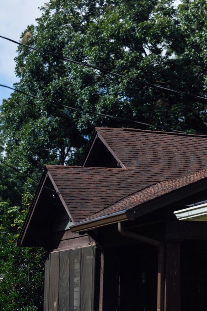 Asphalt shingle roof and gutters checked during a home inspection