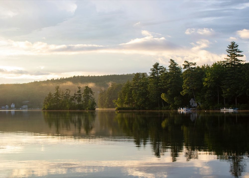 Lakeside homes along the water at sunset