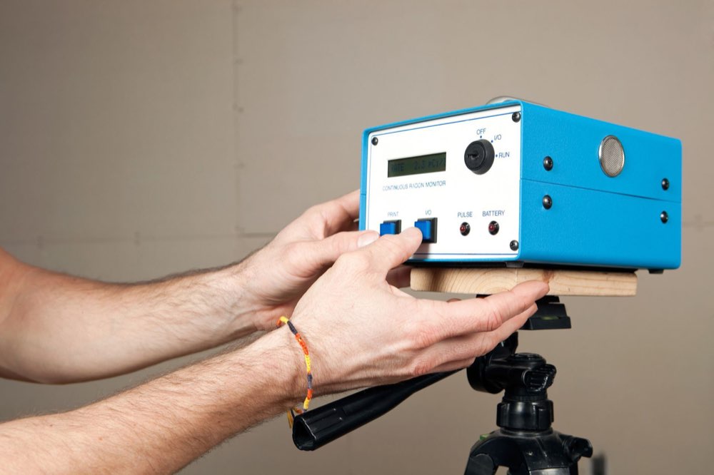 Continuous radon monitor set up for radon testing in a basement