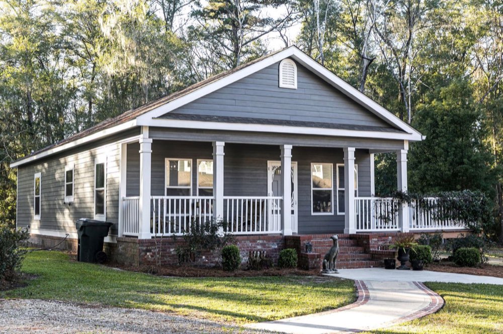 Single-story home with a covered front porch and landscaped yard